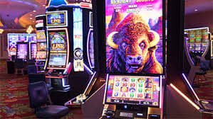toto155 slot game screen showing reels and jackpot symbols on mobile